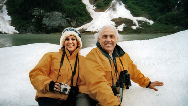 Karen and Lee Duquette touch a big iceberg